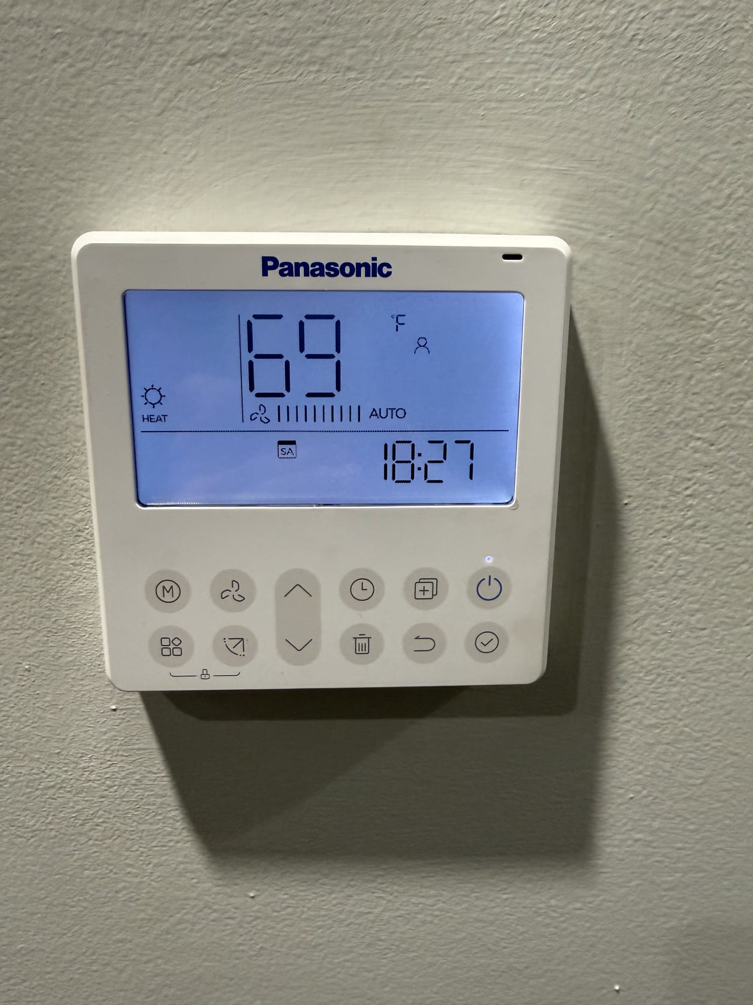 Smart thermostat on wall